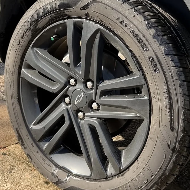 Chevy wheel before cleaning, dull and dusty