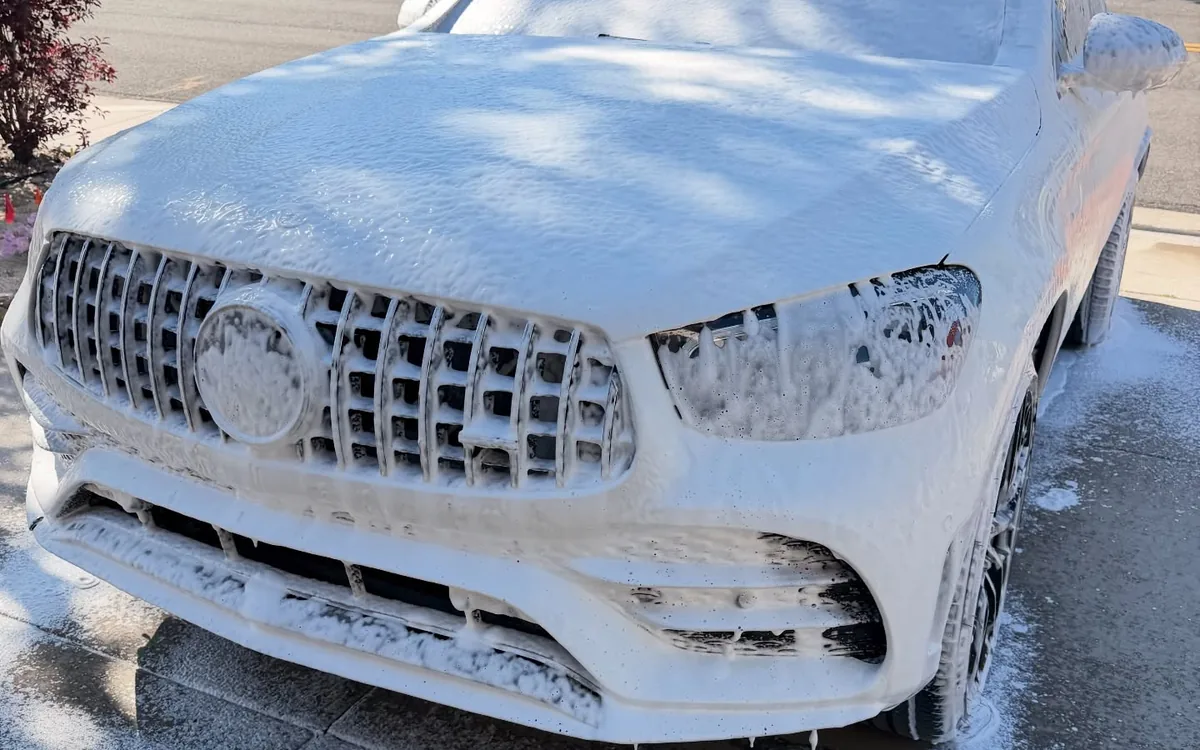 Mercedes SUV covered in foam during a mobile exterior wash