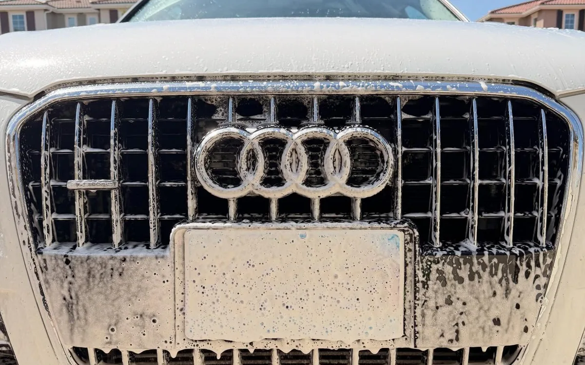 Audi grille being foam washed during a full detail